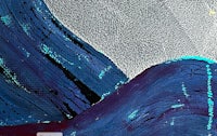 a painting of a blue and white wave